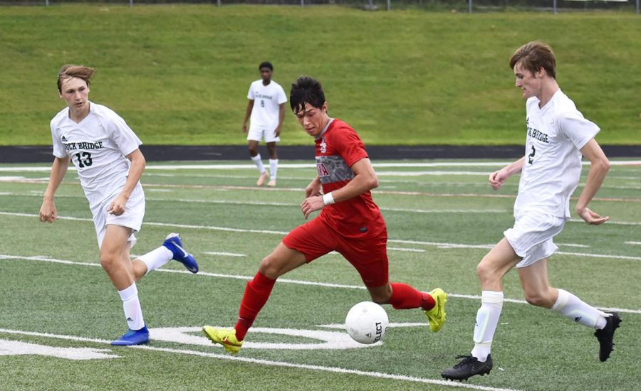 Photo by: Katelynn Gibson
Cooper Hines, senior, keeps his eye on the ball as the opposing team closes in.
