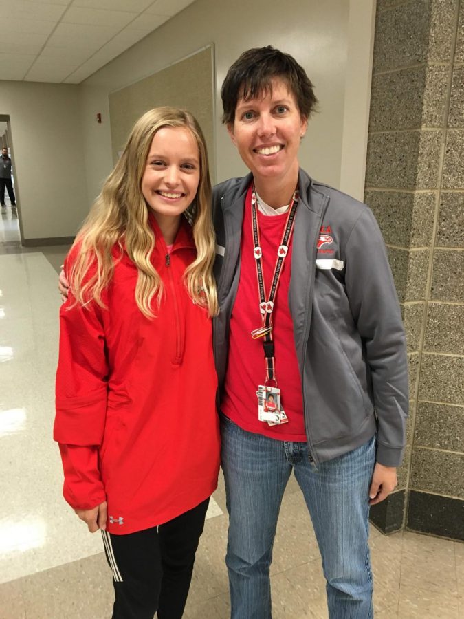 Riann Lubinski and sophomore Alicen Ashley pose for a picture.  The first year that the COC had an official Cross Country Championship, Lubinksi won the girls varsity race.  The next Nixa girl to win a COC championship was this past season when Alicen Ashley won.  