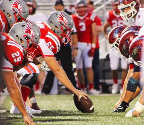 Nixa Eagles center prepares to snap the football to his quarterback.