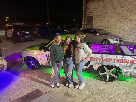 Junior Lotta Meseck from Germany (left) poses with her friends Senior Payton
LaRue and Zoe McQuerter for a spooky night at Hotel of Terror.
