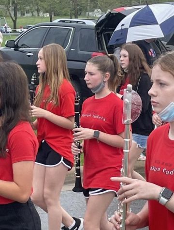 Leah Vannoy (7,from left), Isabella Knight (7), Dina Bardadin (7)
march for their first time in the Sucker Day Parade as seventh graders.