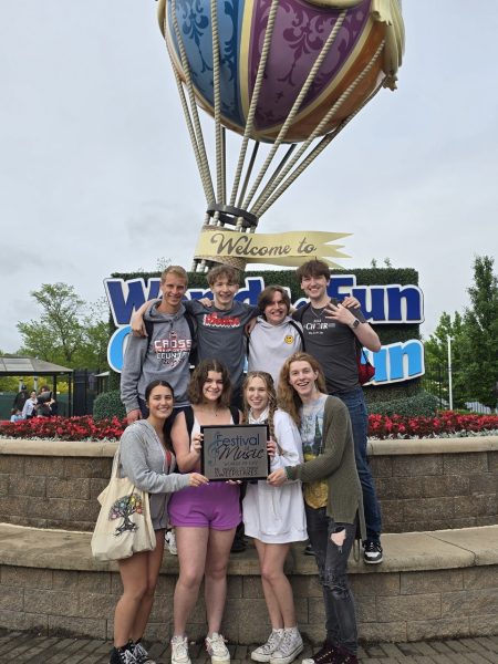 Chamber Choir seniors gather at Worlds of Fun with their sweepstakes award for the third year in a row.  ROW 1: Ariana Atkinson (12, left), Abby Teberian (12), Makenna Winkler (12) and Reya Vaughan (12).
ROW 2: Alexander Worthley (12), Blake Marsh (12), Collin Scott (12) and Cameron Donnell (12).