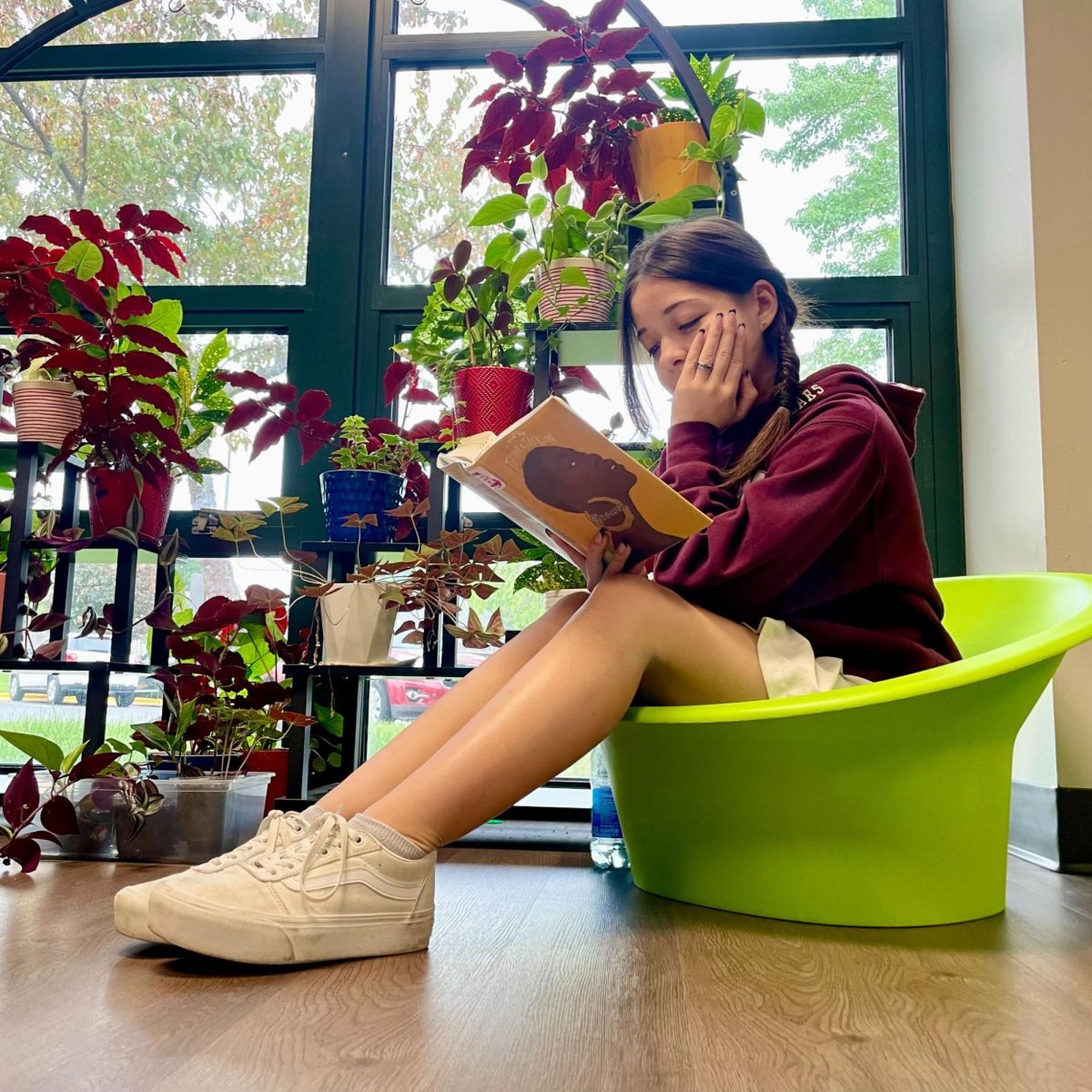 Senior+Kaitlyn+Ornelas+sits+comfortably+in+the+NHS+library.+One+of+her+favorite+ways+to+relax+during+the+summer+is+to+read.++%E2%80%9CI+read+all+the+time%2C%E2%80%9D+Ornelas+said.+%E2%80%9CIt%E2%80%99s+a+good+way+to+chill+and+spend+my+time.%E2%80%9D