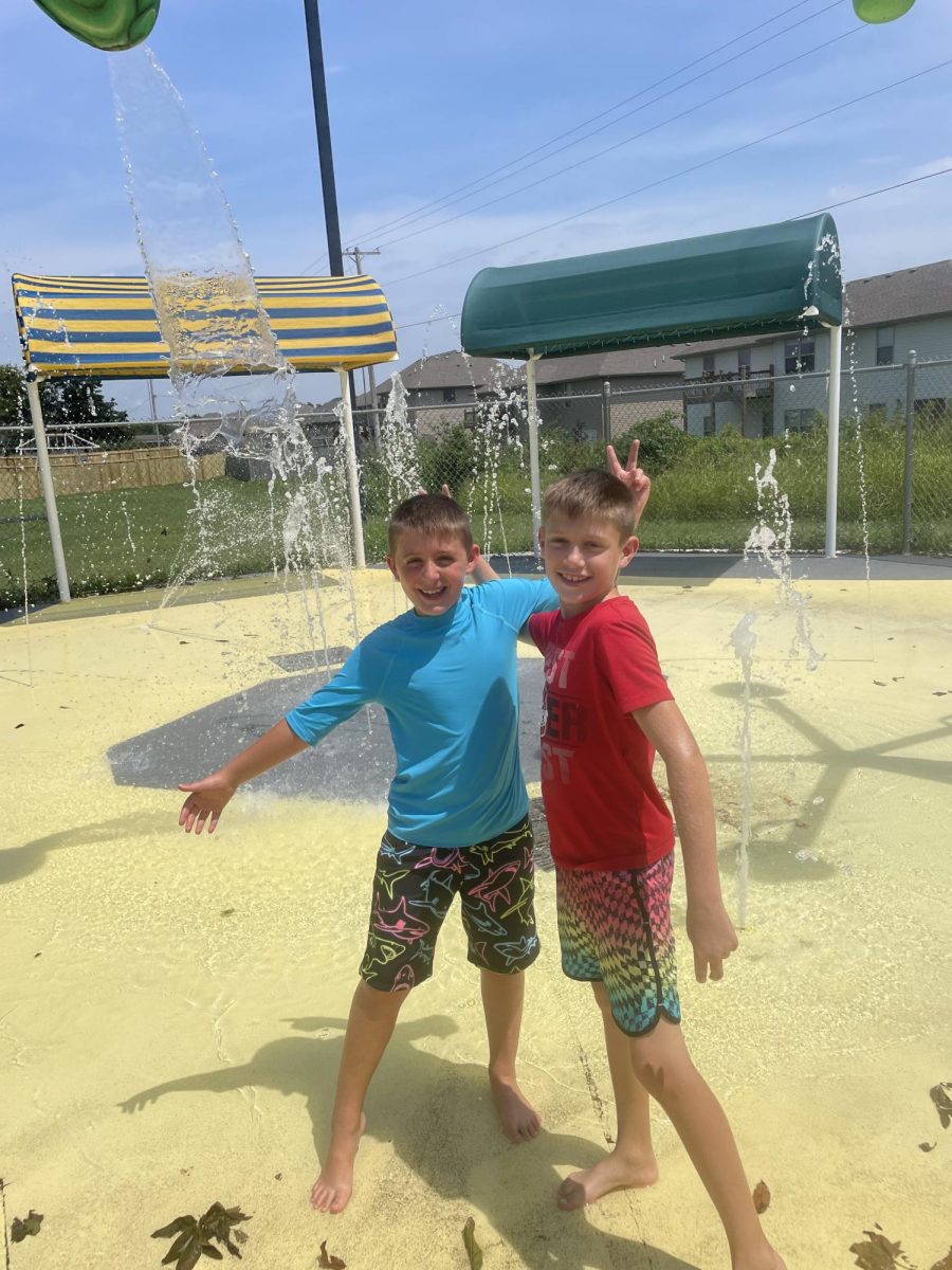 Jackson+Meyer+and+Caleb+Spencer+pose+for+a+photo+after+running+through+the+splash+pad+spraying+each+other+with+water+guns.+Coming+to+the+pool+to+hang+out+with+my+friends+during+the+summer+is+a+lot+of+fun%2C+said+Spencer.