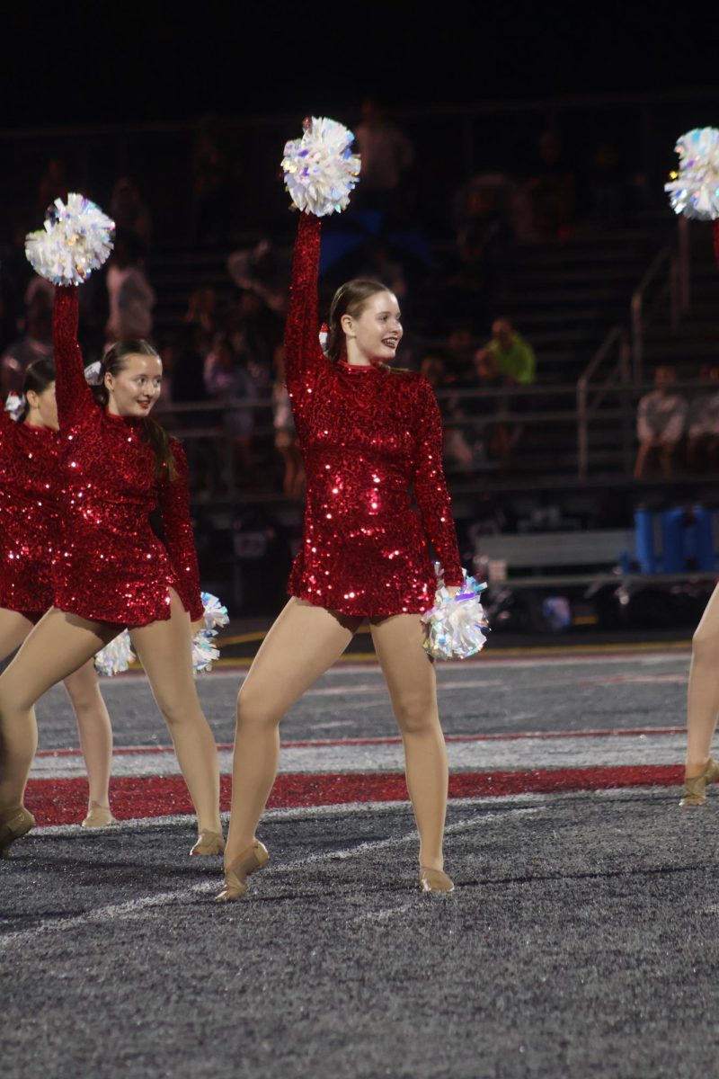 Senior Ava Weaver dances at a home football game.
