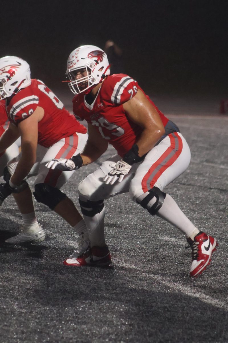 Offensive lineman Jackson Cantwell dropping back to block