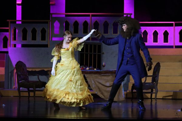 Morgan Upton-Rowley (11) as Belle and Maxx Pyle (12) as Beast, dance to “Beauty and the Beast”.