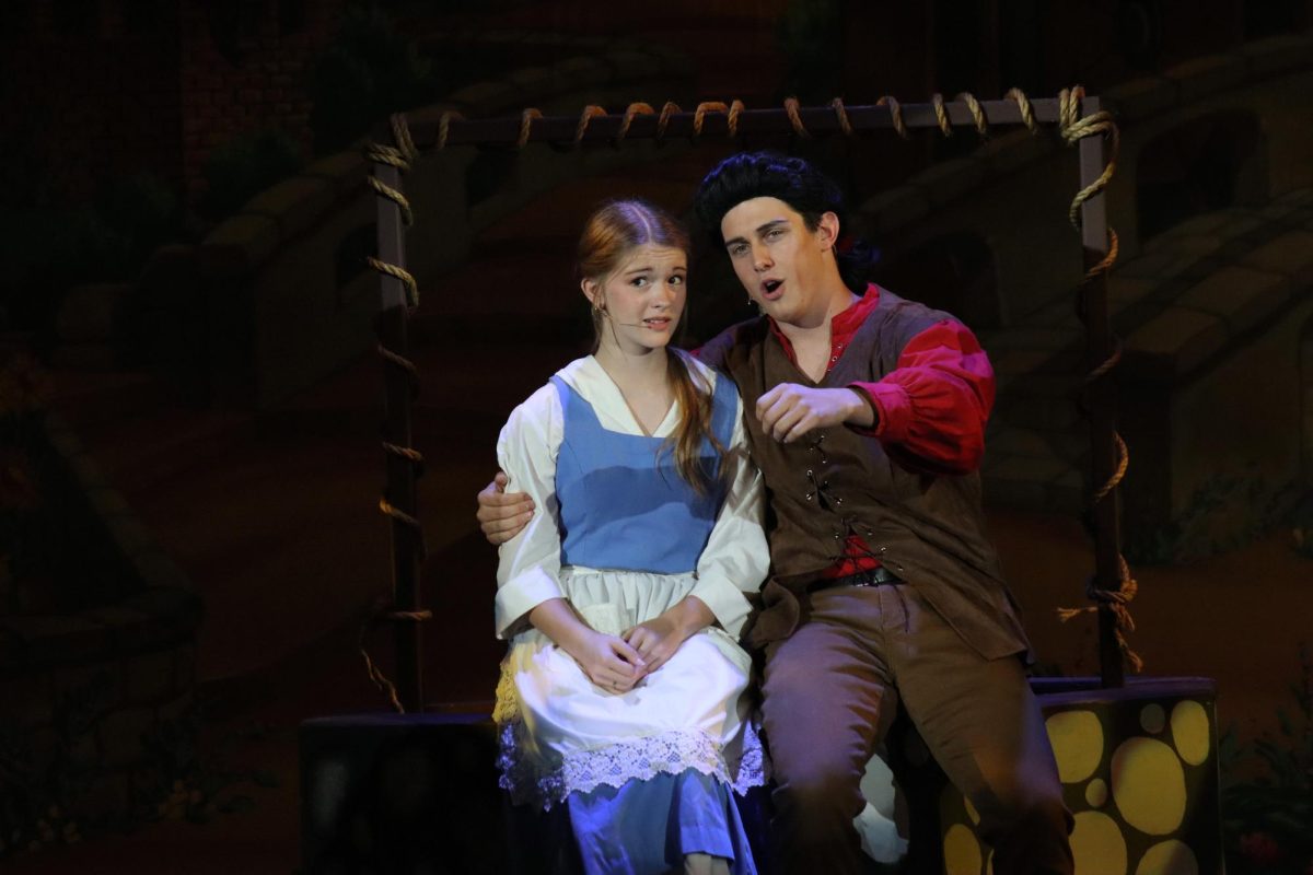 Morgan Upton-Rowley (11) as Belle and Deacon Brown (12) as Gaston.