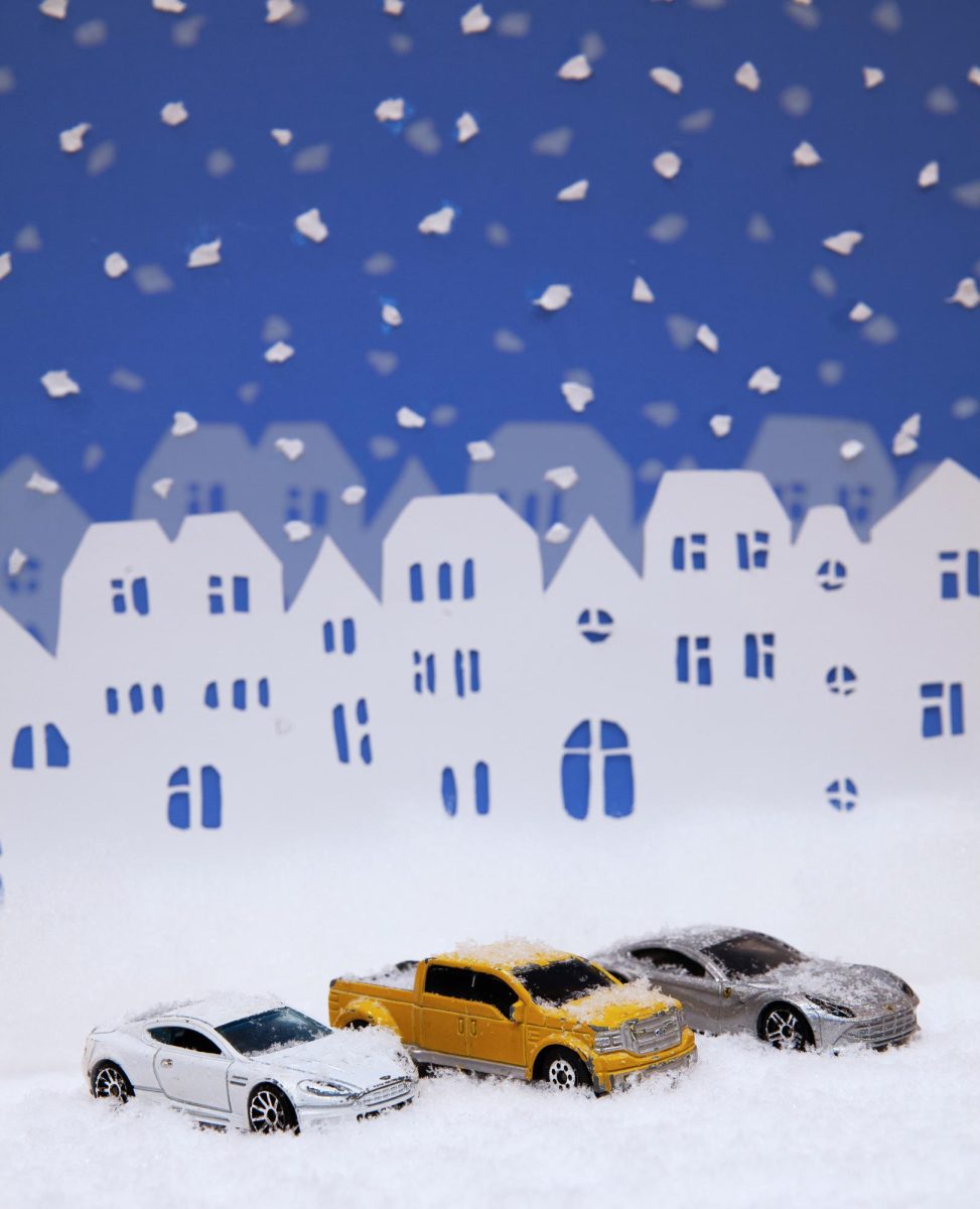 Car figurines against a snowy backdrop