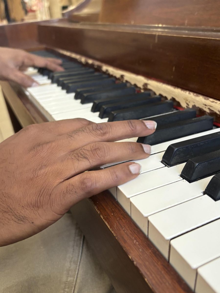 Missouri State University student Chatura plays the Piano in the Plaster Student Union.   