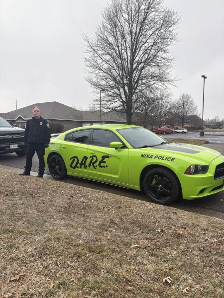 Nixa Police Drug Abuse Resistance Education Officer Brent Forgey works together with his D.A.R.E police car in schools. “You take the time to go to their school and be in the classroom and meet and present a program as something that can benefit their future,” Forgey said. “That's what we try to do with the D.A.R.E program, is have a positive impact on the students in our community and work with them.”