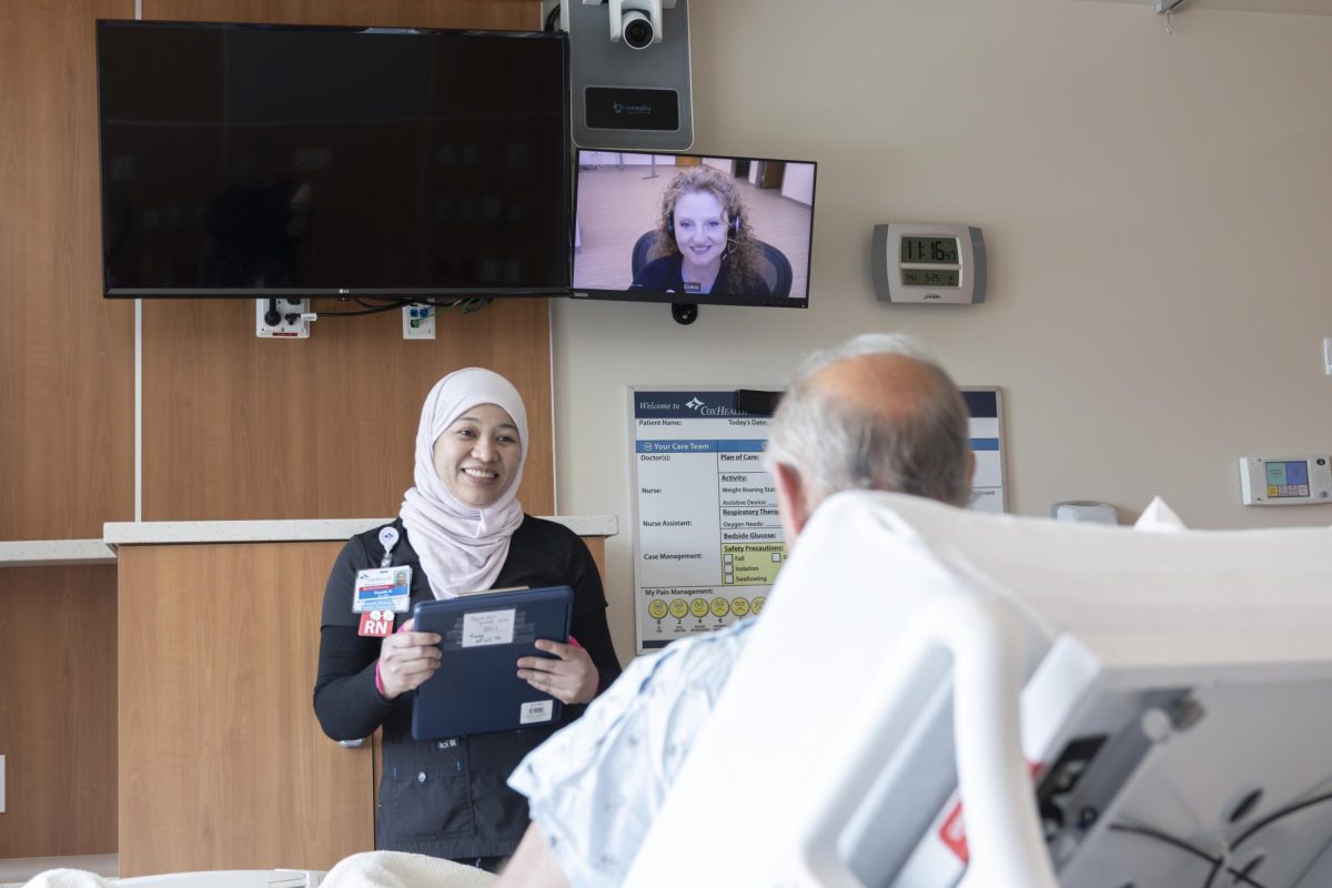  A Virtual care team member monitors patients remotely at the Coxhealth Care Command Center. “We are helping the nurses do tasks… so they can be in the rooms with their patients more and less time at the computer,” said Kaylee Welch.
