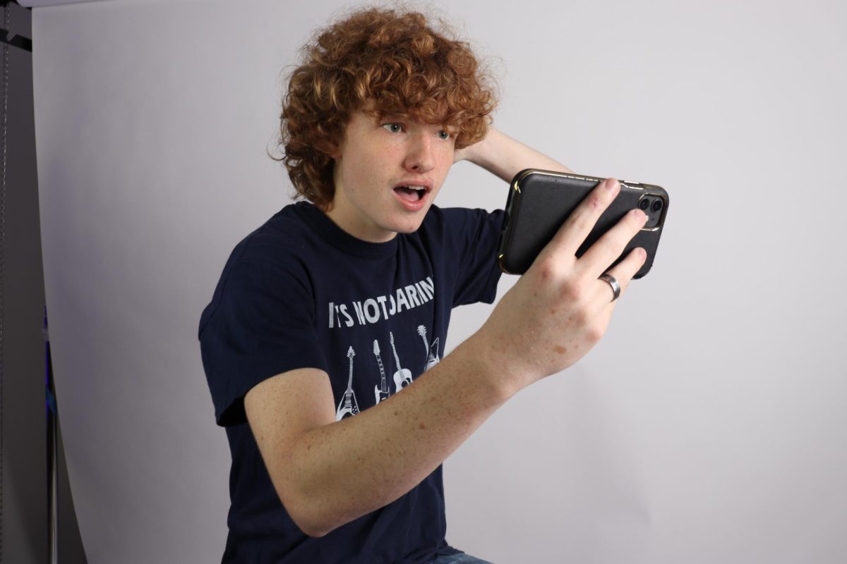 Sophomore John Knoop reacts to a request for age verification on YouTube.  According to Globalmediainsight.com, 87 percent of social media users are 18 or older, and roughly 90 percent of teens use YouTube.
