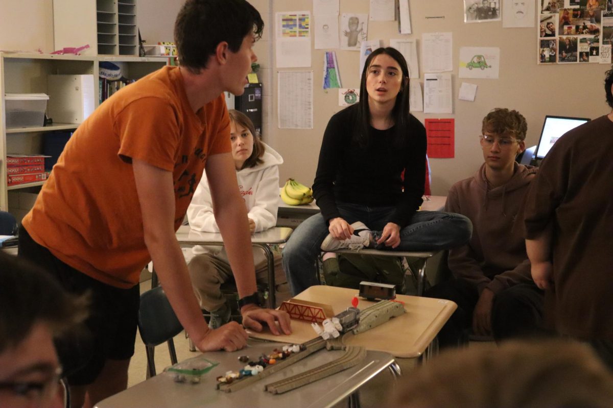 Philosophy Club: Senior Zane Novinger demonstrates "The Trolley Problem" to Philosophy Club. 