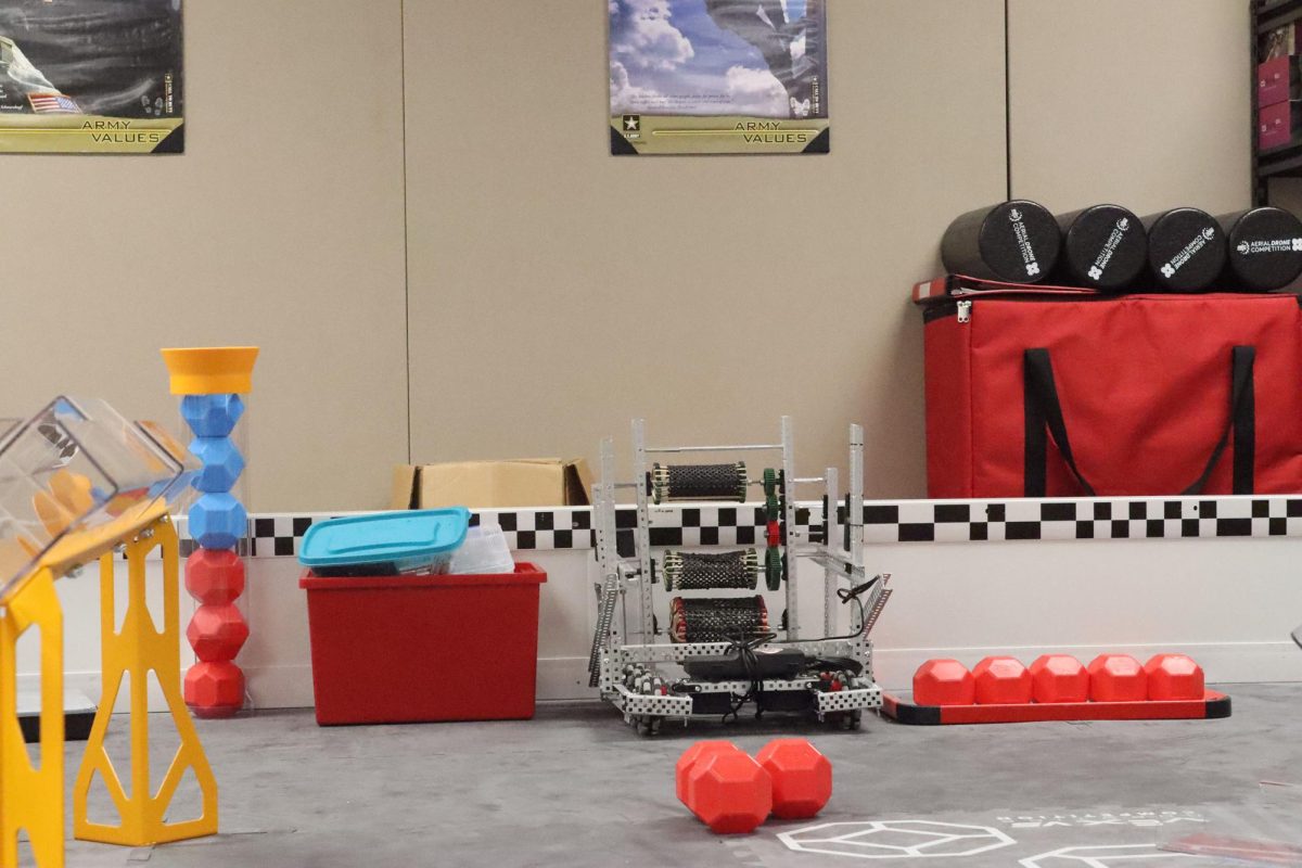 This year’s robot, whom the team calls Clanker, practicing for competitions. “[In this challenge], you're lining your robot up to put those balls in those little tunnels there and while you're doing it you're getting hit from the side,” Robert Hodapp said. 
