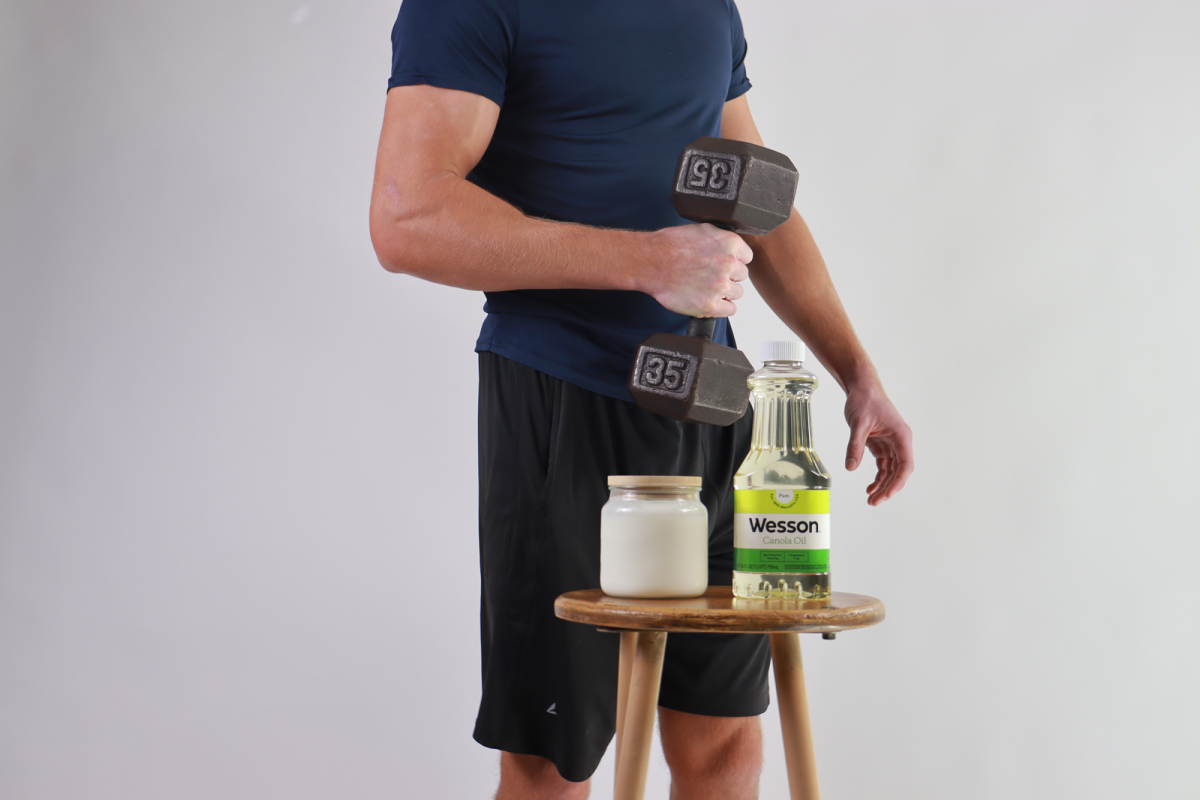 Junior Cross Potts poses next to seed oils and raw milk. 