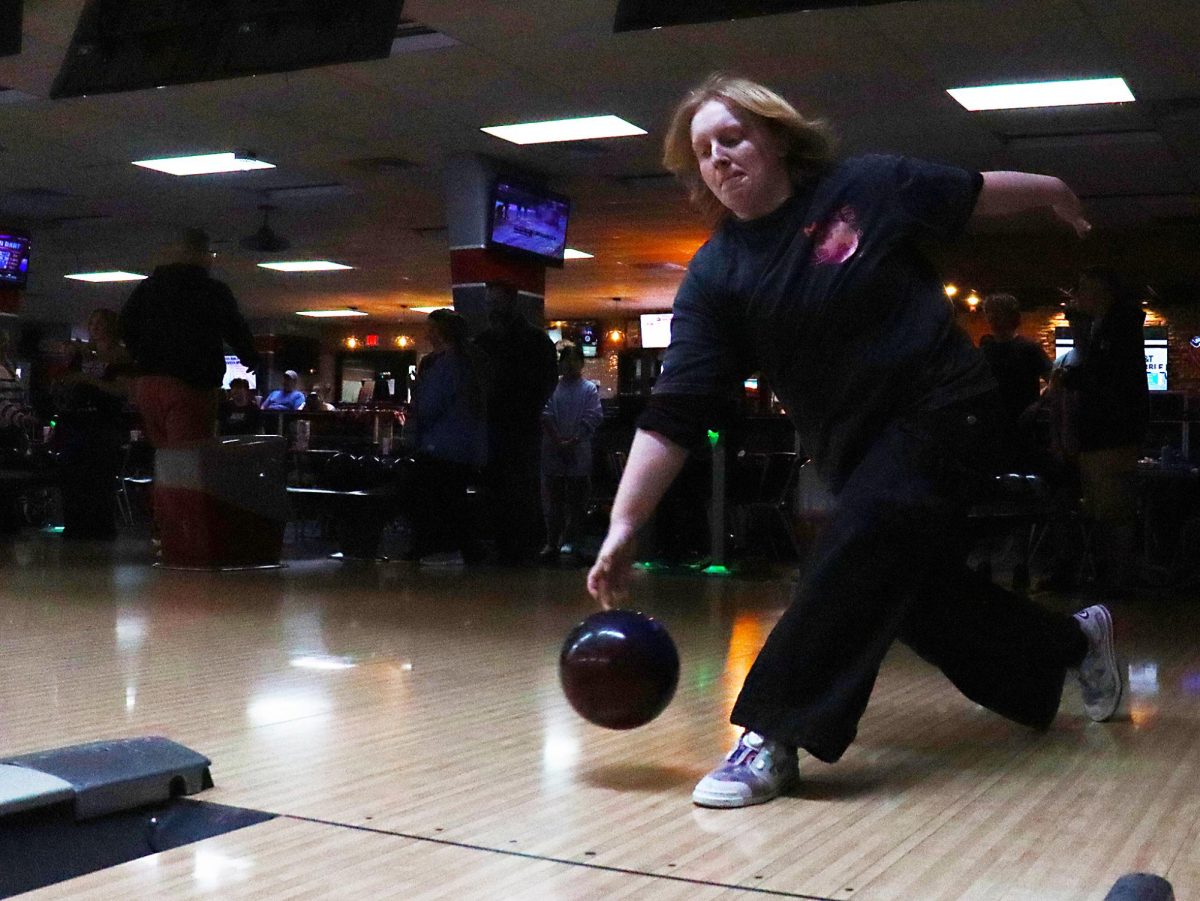 Junior Nicolette (Jax) Fowler practices for an upcoming competition at Century Lanes. “The biggest thing is figuring out how you want to throw- if you want to throw a straight two handed or hook, and then figuring out where you're going to place your mark from there,” Fowler said.
