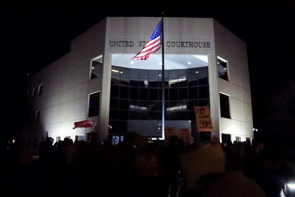Anti-ICE protesters stand outside U.S. District Court in Springfield on Jan. 8. 
