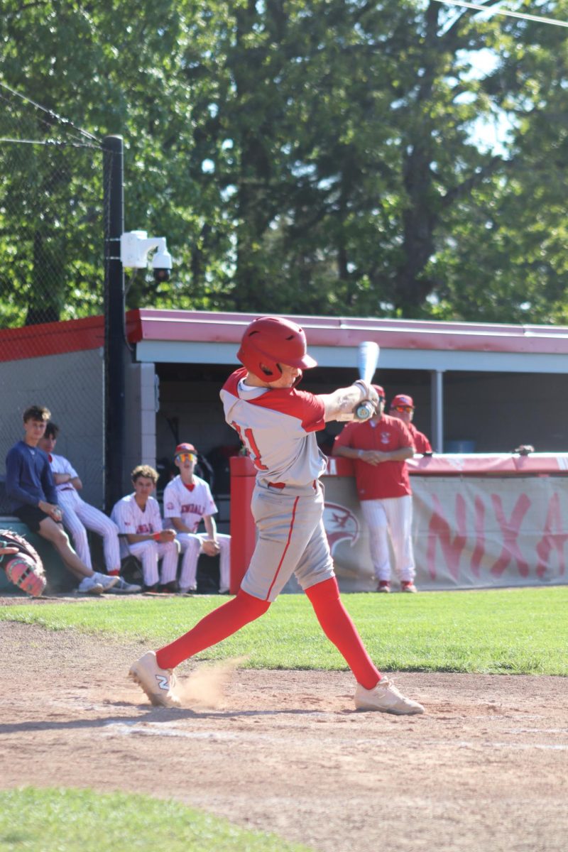 Freshman Jett Kellis is up to bat, hitting the ball making the score 10-0.